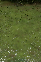 Waterdrops on Glass with Green Background Texture/Background. Abstract.