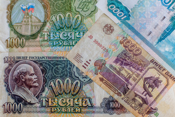Obraz premium Russian ruble. Russian and Soviet money of different years. Banknotes in a thousand rubles of different years. Money USSR transition period. Cash. Background texture.