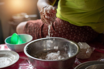 mom hand  Squeezing coconut milk
