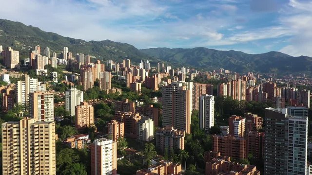 Beautiful Cinematic Drone Aerial of Medellin City El Poblado Colombia Residental Buildings With Skyline Over Hills 4k