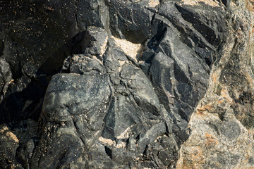 Rocks with Striations and Grooves at Sand Beach, Acadia National Park, Bar Harbor Maine A gorgeous beach surrounded by interesting rocks, cliffs and forest.