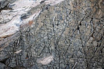 Large Rocks with Striations and Grooves on the Shore Path Bar Harbor Maine Unique rocks with interesting and intricate textures. Beautiful path along the Atlantic ocean featuring all types of rocks.
