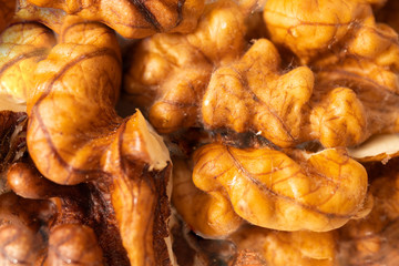 Background texture of peeled walnuts. Macro. Walnuts without shells close-up.