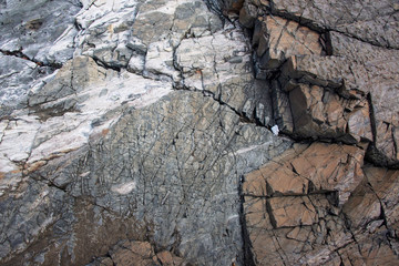 Large Rocks with Striations and Grooves on the Shore Path Bar Harbor Maine Unique rocks with interesting and intricate textures. Beautiful path along the Atlantic ocean featuring all types of rocks.