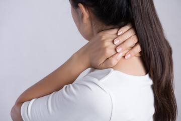 Fototapeta premium Closeup woman neck and shoulder pain and injury. Health care and medical concept.