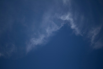 Obraz premium Fluffy Little Clouds. Blue skies and wispy clouds on a gorgeous summer day.