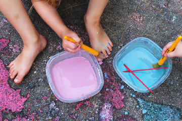 Sidewalk paint preparation and use in a daycare/home school setting. Fun childhood STEM and art activity. Messy fun. Science. 