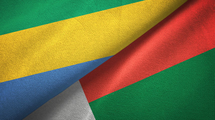 Gabon and Madagascar two flags textile cloth, fabric texture
