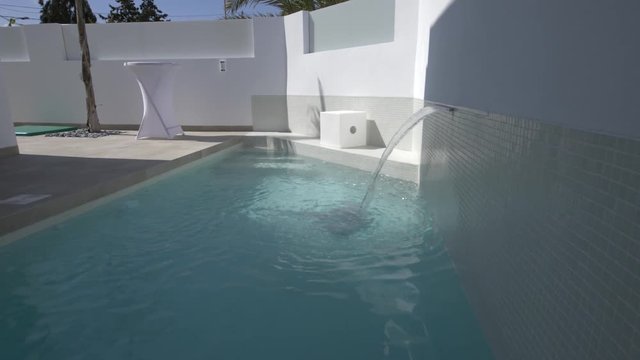 swimming pool with water fature in Spain