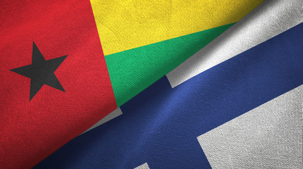 Guinea-Bissau and Finland two flags textile cloth, fabric texture