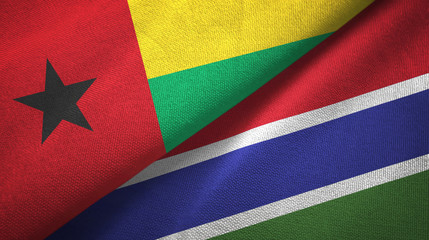Fototapeta premium Guinea-Bissau and Gambia two flags textile cloth, fabric texture