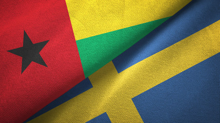 Guinea-Bissau and Sweden two flags textile cloth, fabric texture