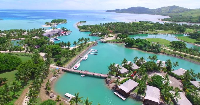 Plantation Island Fiji showing Aerial Footage Resort and Vivid Ocean Colours.