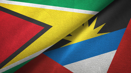 Guyana and Antigua and Barbuda two flags textile cloth, fabric texture 