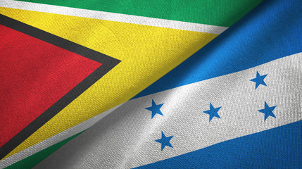 Guyana and Honduras two flags textile cloth, fabric texture