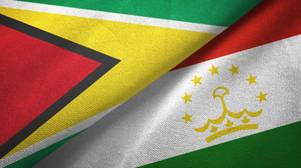 Fototapeta premium Guyana and Tajikistan two flags textile cloth, fabric texture