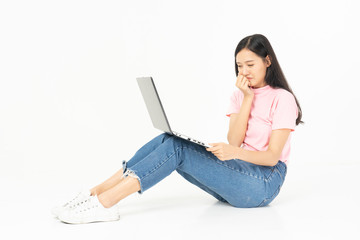 Happy asian teen passenger listening to the music with headphones while holding  mobile phone.businesswoman listening to music with headphones while dancing isolated over white background