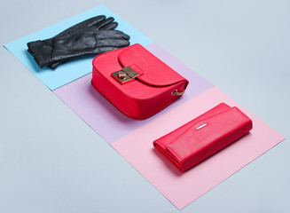 Minimalist fashion. Women's trendy accessories on a pastel background. Leather purse, bag, gloves....
