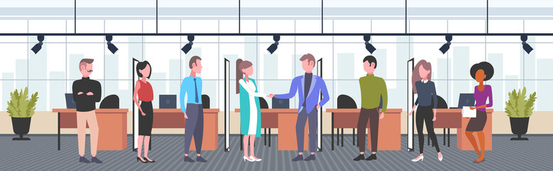 tow business partners team leaders shaking hands men women businesspeople agreement partnership concept co-working open space center modern office interior flat horizontal full length