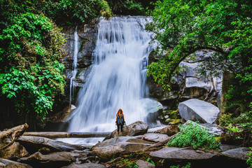 Women travel. woman asia travelers travel nature Forests, mountains, waterfalls. Travel Siliphum Waterfall at Chiangmai, in  Thailand.