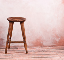 Wooden retro chair on the wall background. Copy space. Vintage interior