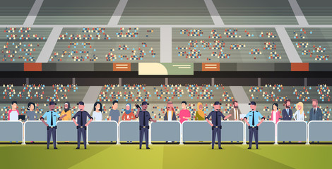 mix race police officers group controlling fans crowd on sport stadium arena at football match championship safety support concept flat horizontal full length © mast3r