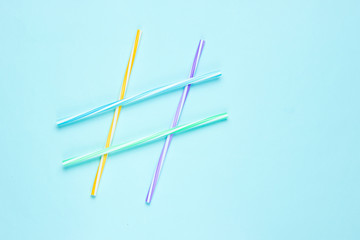 Cocktail tubs in the form of hashtag symbol on blue background.