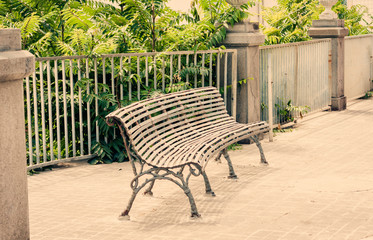 metal bench in public garden in Acitrezza, Catania, Sicily, Southern Italy.