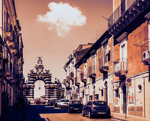 Fototapeta premium Catania, Sicily, Italy, street view of famous landmark – gate Porta Garibaldi in Catania, Sicily, Italy.