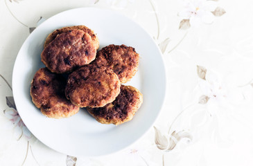 homemade fried minced meat cutlets on white plate, traditional Ukrainian dish .