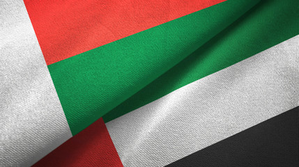 Madagascar and United Arab Emirates two flags textile cloth, fabric texture