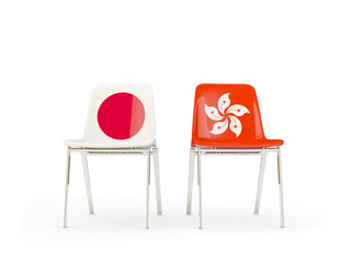 Two chairs with flags of Japan and hong kong isolated on white