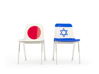 Two chairs with flags of Japan and israel isolated on white