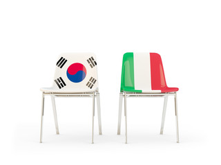 Two chairs with flags of South Korea and italy isolated on white