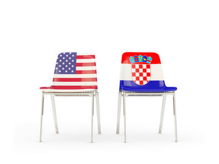 Two chairs with flags of United States and croatia isolated on white