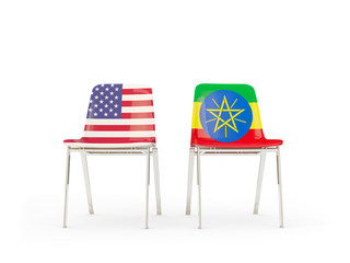 Two chairs with flags of United States and ethiopia isolated on white