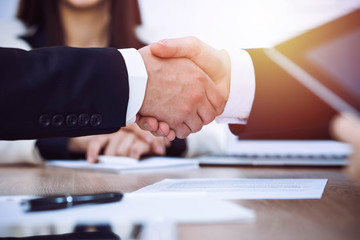 Business people shaking hands at meeting or negotiation in the office. Handshake concept. Partners are satisfied because signing contract