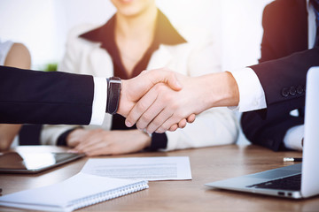 Business people shaking hands at meeting or negotiation in the office. Handshake concept. Partners are satisfied because signing contract