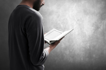 Muslim man reading holy quran