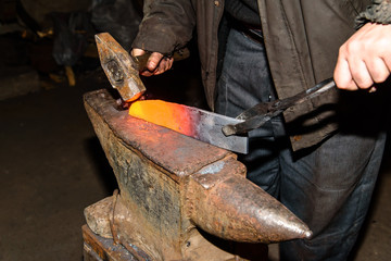 Forging molten metal. Making knives.