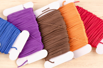 colorful stacking cotton yarn wool over beautiful reverberation gradient background.