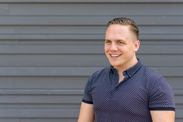 Obraz premium Happy young man with a beaming smile