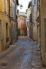 Fototapeta na wymiar people walking in a narrow street 