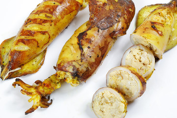 Charcoal grilled stuffed Squid Calamari cattle fish on white background
