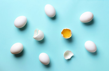 Food concept with white eggs on blue background. Top view. Creative pattern in minimal style. Flat lay