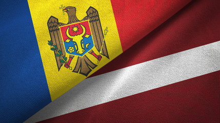 Fototapeta premium Moldova and Latvia two flags textile cloth, fabric texture