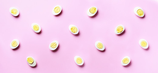Food concept with boiled eggs pattern on pink background. Top view. Creative pattern in minimal style. Flat lay. Banner