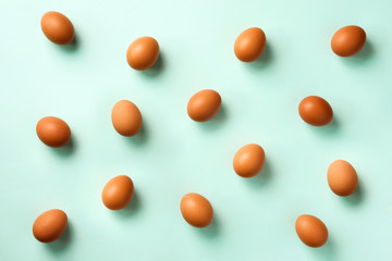 Food concept with white chicken eggs on blue background. Top view. Creative pattern in minimal style. Flat lay.