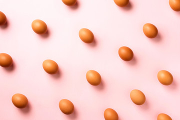 Food concept with chicken eggs on pink background. Top view. Creative pattern in minimal style. Flat lay.