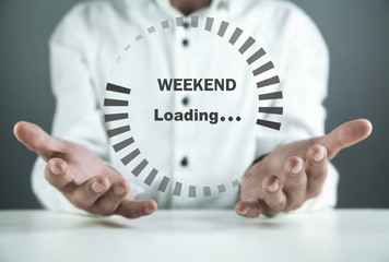  Man holding loading icon. Weekend loading concept